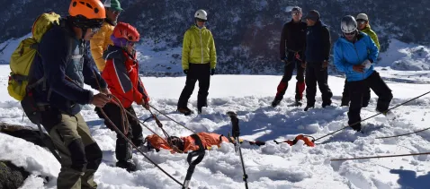 Implemented international safety protocols, mandatory staff training, CPR and First Aid certifications, high-altitude risk assessment programs, and emergency evacuation support systems.